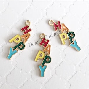 May include: Two gold-colored metal charms spelling out the word "HAPPY" in colorful enamel. Each charm has a loop at the top for attaching to a necklace or bracelet.