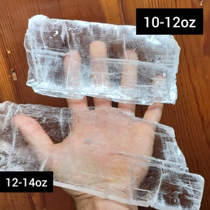 May include: Two pieces of clear selenite crystal, one is 10-12 oz and the other is 12-14 oz.