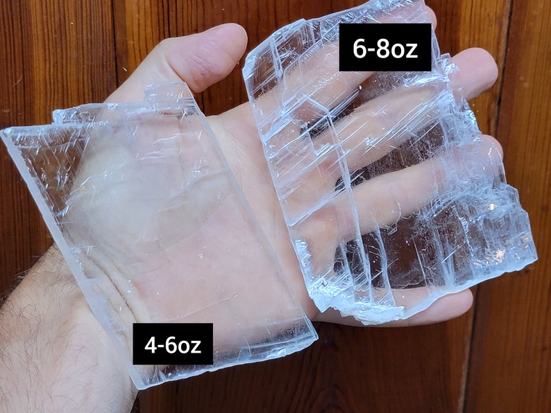 May include: Two pieces of clear selenite crystal, one labeled "4-6oz" and the other labeled "6-8oz".