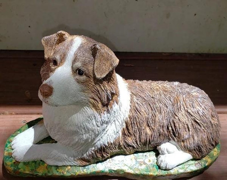 Australian Shepherd Dog Concrete statue Measuring  5 x 11 at the base, 6-1/2" tall, and weighing nearly 8 lbs A good size for an outdoor memory garden or grave marker and still a nice size for indoor use on a mantel desk bookshelf. Pet loss gift.