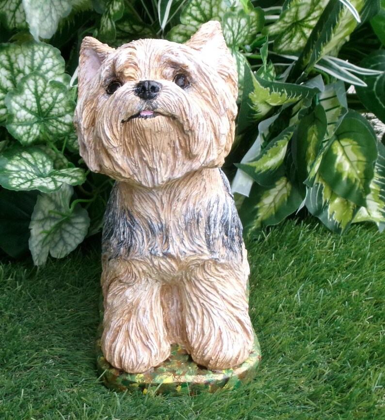 Yorkshire Terrier Statue 4 x 8 x 9" high, and Cast in fine grained white concrete, This high detail piece is Mini-Me painted (Per your photos) as a loving reminder of a best friend that had to leave too soon.  weighs nearly 8 lbs