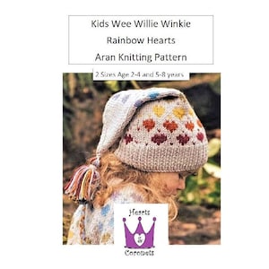 May include: A knitted hat with a rainbow heart pattern and a pom-pom. The hat is beige with a rainbow coloured heart pattern. The pom-pom is multi-coloured. The hat is for children and is available in two sizes: 2-4 years and 5-8 years. The pattern is called "Kids Wee Willie Winkie Rainbow Hearts Aran Knitting Pattern".