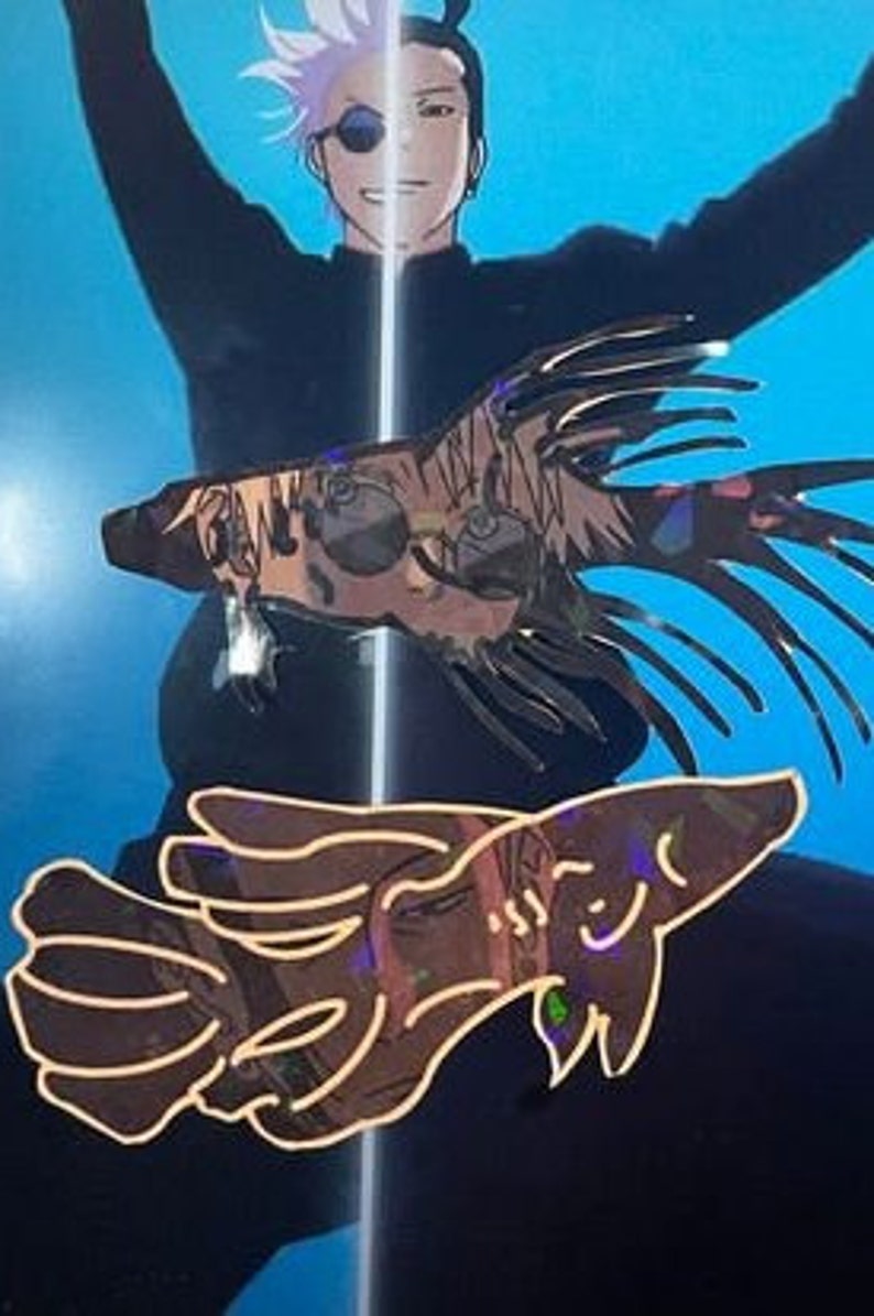 May include: Two iridescent fish-shaped stickers with a holographic effect. The stickers have a detailed design with multiple colors and are set against a blue background. The stickers appear to be decorative.