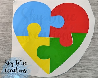 Pegatina de vinilo con forma de corazón con una pieza de rompecabezas para concienciar sobre el autismo
