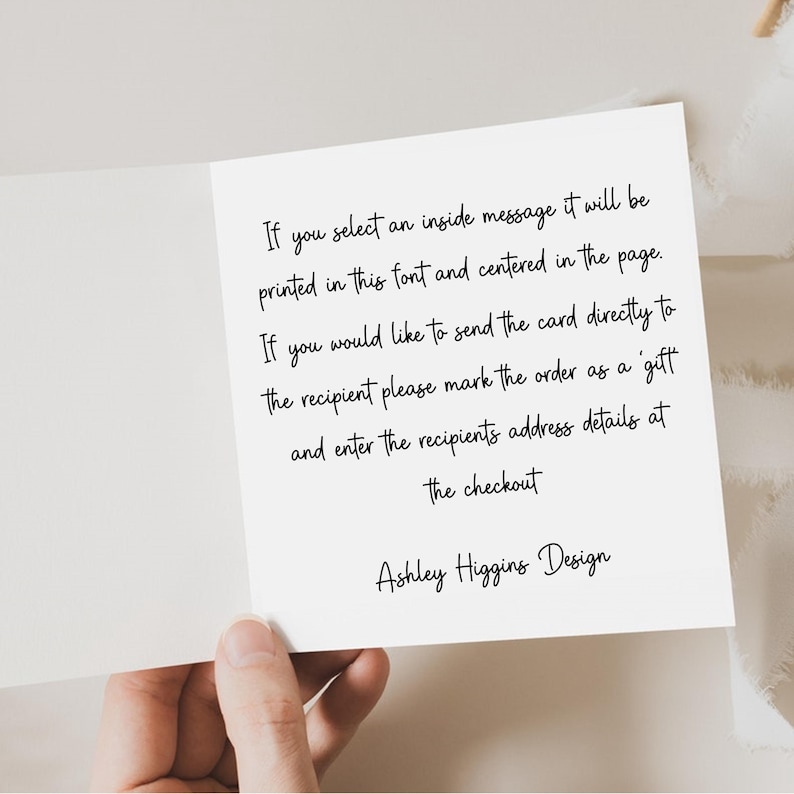 May include: An open greeting card with text in black script. The text provides instructions for sending a card directly to a recipient and selecting an inside message. The card is held by a hand.