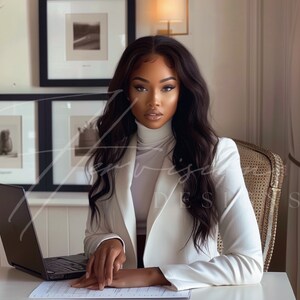 a black woman with long wavy hair brazilian hd wig, wearing a white suit with a white turtle neck, she is seating on a chair and leaning on a creme desk, on the table there is a laptop mockup, on the wall there is a black framed mockup