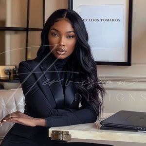 a black woman with long wavy hair brazilian hd wig, wearing a white suit with a white turtle neck, she is seating on a chair and leaning on a creme desk, on the table there is a laptop mockup, on the wall there is a black framed mockup