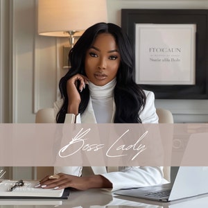 a black woman with long wavy hair brazilian hd wig, wearing a white suit with a white turtle neck, she is seating on a chair and leaning on a creme desk, on the table there is a laptop mockup, on the wall there is a black framed mockup