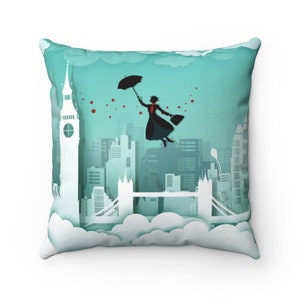 May include: A decorative throw pillow with a whimsical illustration of a woman flying with an umbrella over a cityscape. The cityscape features the iconic London landmarks, Big Ben and Tower Bridge, with a blue sky and white clouds in the background.