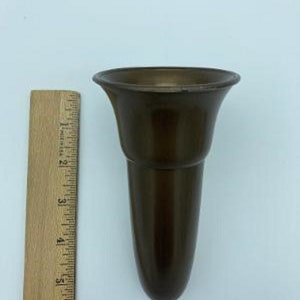 May include: A brown ceramic bud vase with a flared top and a narrow base.