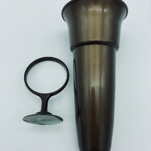 May include: A brown plastic vase with a flared top and a round base. The vase has a shiny finish and is designed to hold flowers.