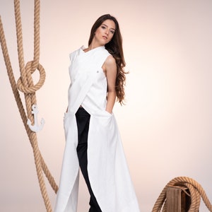 White futuristic sleeveless tunic for women. Wrap linen top with pockets in mid century modern style. Handmade Linen Clothing