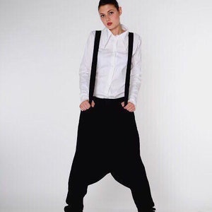 Black drop crotch women pants in harem style. Oversized high rise wide leg baggy fit pants