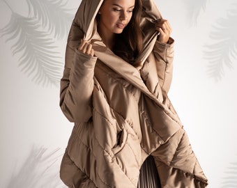 Hooded puffer jacket in avant garde style perfect for the winter season, asymmetrical oversized jacket