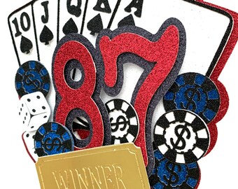 May include: A red and black glitter cake topper with the numbers 87, playing cards, dice, and poker chips. The topper also includes a gold ticket with the word "WINNER" printed on it.