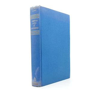 May include: A hardcover book titled "Through Gates of Splendour" by Elisabeth Elliot. The book has a light blue cover and spine with gold lettering. The spine also features horizontal gold lines.