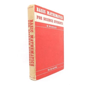 May include: A vintage book titled "Basic Mathematics for Science Students" by W. Woodcock. The book has a red cover with white text and a tan spine. The title is also printed vertically on the spine. The publisher's name, Butterworths, is at the bottom.