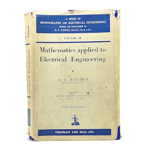 May include: A vintage book titled "Mathematics applied to Electrical Engineering" by A.G. Warren. The cover is off-white with blue text and accents, including the publisher's name, "CHAPMAN AND HALL LTD." The book is part of a series on electrical engineering.