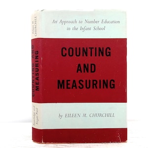 May include: A hardcover book titled "Counting and Measuring" by Eileen M. Churchill. The book has a red spine and a red cover with white text. The title is in large, bold letters. The book is about number education in the infant school.