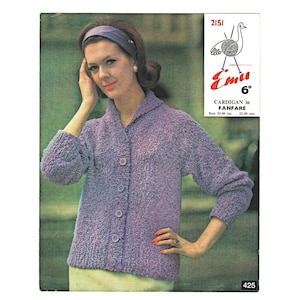 May include: A vintage knitting pattern cover featuring a woman wearing a lavender cardigan. The cardigan has a textured appearance and is buttoned up. The cover includes the text "CARDIGAN in FANFARE" and "Emu".