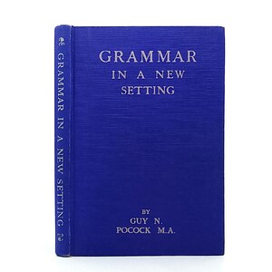 May include: A hardbound book with a vibrant blue cover and silver lettering. The front cover and spine display the title Grammar in a New Setting and the author name Guy N. Pocock M.A. The book features a textured fabric-like finish on the cover.
