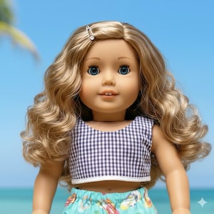 May include: A doll with long, wavy blonde hair and blue eyes. The doll wears a navy and white gingham crop top and a turquoise skirt with a colorful pattern. A silver barrette secures the hair. The background is a bright blue.