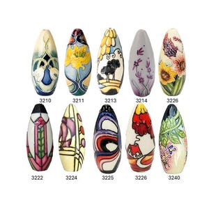 May include: A selection of eleven decorative ceramic vases, each with a distinctive elongated, teardrop form. The vases showcase hand-painted designs, including floral patterns, abstract art, and stylized motifs. The vases are numbered from 3210 to 3240.