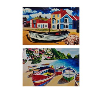 May include: Two paintings of coastal scenes. The top one shows a white boat with the number "IH86" on the side, on a sandy beach with buildings in the background. The bottom painting shows several boats on a beach.