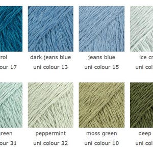 May include: A color palette of yarn samples in various shades of blue, green, and off-white. Each sample is labeled with a color name and a "uni colour" number. Colors include petrol, dark jeans blue, jeans blue, ice crystal, sea green, peppermint, moss green, and deep moss.