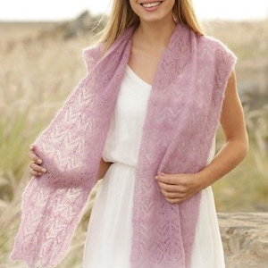 May include: A light purple, open-weave scarf draped over a white dress. The scarf has a delicate, lacy pattern. The image includes the text "DROPS DESIGN" and the website address www.garnstudio.com.