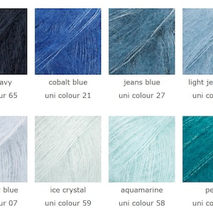 May include: A color palette of eight skeins of yarn in various shades of blue and green. Colors include dark navy, cobalt blue, jeans blue, light jeans blue, light sky blue, ice crystal, aquamarine, and petrol. Each color is labeled with its name and a uni color number.
