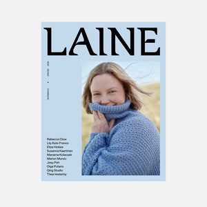 May include: A magazine cover with the word "LAINE" in large black letters. The cover features a woman wearing a blue knit turtleneck sweater. The magazine's title is on a light blue background, with the words "WATERWAYS" and "SPRING 2004" also visible.