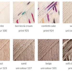 May include: A grid of eight yarn skeins in various neutral and speckled colors. The labels include off white uni colour 100, berries & cream print 925, confetti cake print 924, wheat uni colour 121, peanut uni colour 123, sand uni colour 127, beige uni colour 101, and soft chocolate print 912.