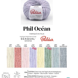 Peut inclure: Une pelote de fil de couleur lilas clair, &eacute;tiquet&eacute;e "Phil Oc&eacute;an", fabriqu&eacute;e &agrave; partir de plastique recycl&eacute; provenant de la mer. Le fil est compos&eacute; de 51% de coton et de 49% de polyester. L'&eacute;tiquette indique &eacute;galement que le fil p&egrave;se 50 grammes et mesure 130 m&egrave;tres de long. Le fil fait partie de l'initiative Seaqual.