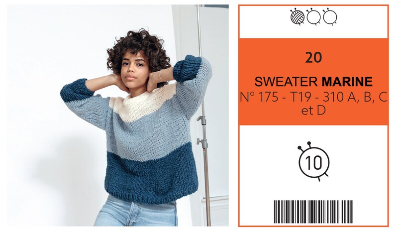 May include: A woman wearing a color-blocked sweater with a cream, light blue, and navy blue design. The sweater has long sleeves and a crew neck. The image also includes a label with the text "SWEATER MARINE".