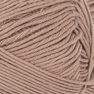 May include: Close-up of a ball of tan yarn. The yarn is tightly wound, with visible individual strands creating a textured surface. The color is a warm, neutral tone, suitable for various knitting or crochet projects.