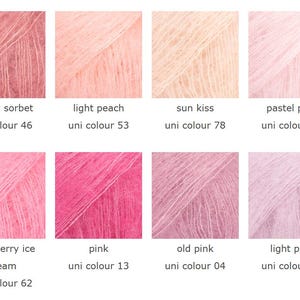 May include: A collection of eight yarn samples in various shades of pink, peach, and cream. Each sample is labeled with a color name and a "uni colour" number. Colors include "cherry sorbet," "light peach," and "sun kiss."