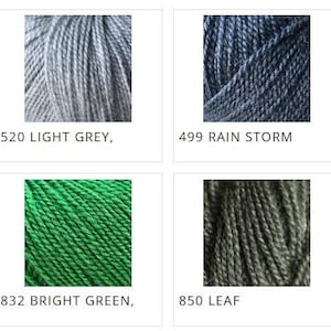 May include: A collection of eight yarn skeins in various colors. The colors include cream, light grey, rain storm, black, lime, bright green, leaf, and forest green. Each skein is labeled with a number and color name.