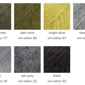 May include: A collection of eight yarn samples in various colors. Colors include dark forest, dark olive, bright olive, steel grey, grey, ash grey, and black. Each sample has the color name and uni color number printed below.