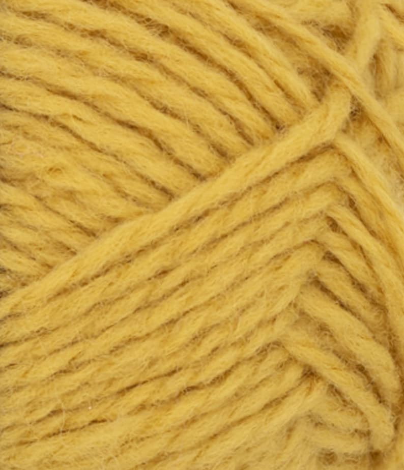 May include: A close-up view of mustard yellow yarn featuring a multi-ply twisted construction. The fibers exhibit a soft, slightly fuzzy texture with visible individual strands woven together in a consistent diagonal pattern throughout the entire frame.