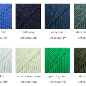 May include: A grid of eight yarn samples in various colors including cobalt blue, dark navy, navy blue, dark blue green, ice blue, pistachio ice cream, parrot green, and dark forest. Each sample is labeled with its color name and uni colour number.