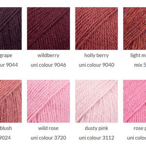 May include: A grid of eight yarn samples in various shades of pink, red, and purple. The colors are labeled as dark grape 9044, wildberry 9046, holly berry 9040, light maroon 5565, dark blush 9024, wild rose 3720, dusty pink 3112, and rose petal 9034.
