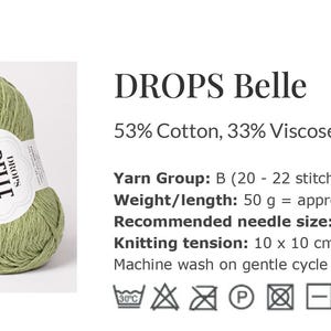 May include: A collection of yarn balls in various neutral colors, with a prominent green ball in the foreground. The label reads "DROPS Belle" and lists the fiber content. The yarn is suitable for knitting, with a recommended needle size of 4 mm.