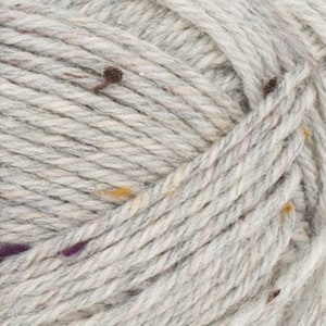 May include: A skein of light gray yarn with flecks of brown, purple, and yellow. The yarn is made of wool and is suitable for knitting or crocheting.