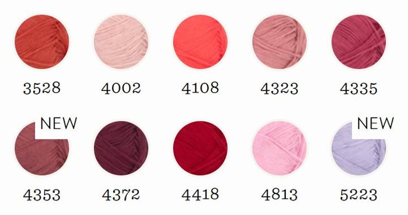 May include: A selection of ten yarn skeins in various shades of red, pink, and purple. Each skein is a circular shape with a unique color and a corresponding number. Two skeins are labeled "NEW".