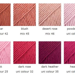 May include: A collection of eight yarn skeins in various colors, including cedar, blush, desert rose, powder pink, pink, dark rose, dark heather, and heather. Each skein is labeled with its color name and a unique identifier.
