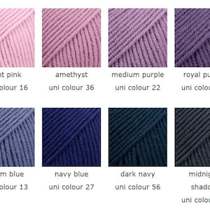 May include: A collection of eight skeins of yarn in various colors, including light pink, amethyst, medium purple, royal purple, storm blue, navy blue, dark navy, and midnight shadow. Each skein is labeled with its color name and a uni color number.