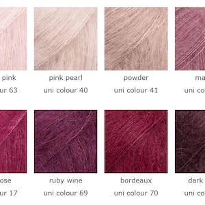 May include: A color palette of eight skeins of yarn in various shades of pink, mauve, and burgundy. Each skein is labeled with a color name and a unique number. Colors include powder pink, pink pearl, powder, mauve, dark rose, ruby wine, bordeaux, and dark grape.