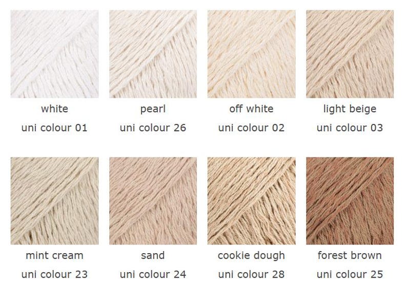 May include: A collection of eight yarn samples in various neutral colors, including white, pearl, off-white, light beige, mint cream, sand, cookie dough, and forest brown. Each sample is labeled with its color name and a corresponding "uni colour" number.