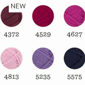 May include: A color chart featuring ten circular yarn samples in shades of burgundy, magenta, pink, purple, navy, and blue. Each sample is labeled with a numerical code: 4363, 4372, 4529, 4627, 4644, 4715, 4813, 5235, 5575, and 5924. The 4372 sample includes the text NEW.